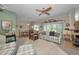 Cozy living room with fireplace, lots of natural light and carpet floors at 5115 S Jules Verne Ct, Tampa, FL 33611