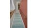 A carpeted stairway with wooden rails leads to the upper level at 5115 S Jules Verne Ct, Tampa, FL 33611