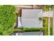 Aerial view of home displaying roof, trees and landscaping at 5143 New Brittany Ln, Zephyrhills, FL 33541
