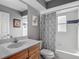 Bathroom with a single sink vanity, toilet, and shower tub combo at 5143 New Brittany Ln, Zephyrhills, FL 33541