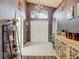 Inviting foyer featuring tile flooring, a decorative chandelier, and a view of the double front doors at 5143 New Brittany Ln, Zephyrhills, FL 33541