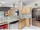 The kitchen features granite countertops, stainless steel dishwasher, and ample cabinet space at 5143 New Brittany Ln, Zephyrhills, FL 33541