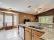 This kitchen has light cabinets, stainless steel appliances, and granite countertops at 5143 New Brittany Ln, Zephyrhills, FL 33541