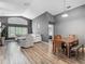 Spacious living area with an open layout that connects to the dining area at 5143 New Brittany Ln, Zephyrhills, FL 33541