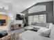 Bright living room with a large window, gray walls, modern furniture and decor at 5143 New Brittany Ln, Zephyrhills, FL 33541