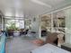 Spacious screened-in patio with cozy seating, ideal for outdoor relaxation at 5143 New Brittany Ln, Zephyrhills, FL 33541