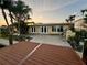 The backyard features a spacious deck and a wall of windows and french doors, perfect for indoor/outdoor living at 530 59Th Ave, St Pete Beach, FL 33706