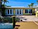 The backyard features a spacious deck and a wall of windows and french doors that let plenty of light inside at 530 59Th Ave, St Pete Beach, FL 33706