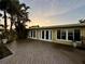 Lovely home featuring a spacious wooden deck, French doors, and a beautiful backyard view at 530 59Th Ave, St Pete Beach, FL 33706