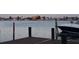 View of a dock and boat featuring tropical residential waterfront at 530 59Th Ave, St Pete Beach, FL 33706