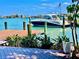 Waterfront view with a boat docked at a private dock at 530 59Th Ave, St Pete Beach, FL 33706