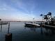 Waterfront view with a boat docked against a dreamy sky at 530 59Th Ave, St Pete Beach, FL 33706