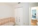 Bright Bedroom with a crib, white closet doors, and neutral color scheme at 6805 S Gabrielle St, Tampa, FL 33611