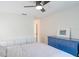 Bedroom with a bed, built in shelves, and a blue dresser at 6805 S Gabrielle St, Tampa, FL 33611