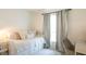 Cozy bedroom featuring a daybed, patterned curtains, and a comfortable workspace at 6805 S Gabrielle St, Tampa, FL 33611