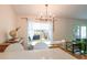Bright dining area next to the kitchen, features a modern chandelier and comfortable seating arrangement at 6805 S Gabrielle St, Tampa, FL 33611