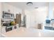Modern kitchen features stainless steel appliances, white cabinets, and a spacious quartz countertop at 6805 S Gabrielle St, Tampa, FL 33611
