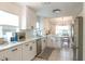 This bright kitchen features stainless steel appliances and an adjacent dining area at 6805 S Gabrielle St, Tampa, FL 33611