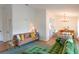 Bright living room featuring modern decor, wood floors, and an inviting atmosphere that flows into the dining area at 6805 S Gabrielle St, Tampa, FL 33611
