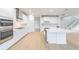 Modern kitchen featuring white cabinetry, a center island, stainless steel appliances, and hardwood flooring at 720 W Peninsular St, Tampa, FL 33603