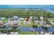 The aerial view showcases the property and neighborhood within proximity to waterfront canal at 814 Seabreeze Dr, Ruskin, FL 33570