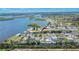 An aerial view of a charming home with canal access and beautiful water views in a waterfront community at 814 Seabreeze Dr, Ruskin, FL 33570