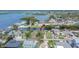 Waterfront community aerial view featuring direct canal access, mature landscaping, and charming homes at 814 Seabreeze Dr, Ruskin, FL 33570