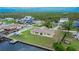 The aerial shows backyard with dock and waterfront access with canal and adjacent homes at 814 Seabreeze Dr, Ruskin, FL 33570