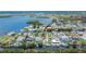 An aerial view of a charming home with canal access and beautiful water views in a waterfront community at 814 Seabreeze Dr, Ruskin, FL 33570