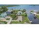 An aerial view of a home with canal access and beautiful water views in a waterfront community at 814 Seabreeze Dr, Ruskin, FL 33570