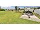 Waterfront lot with boat on trailer and dock with bench seating at 814 Seabreeze Dr, Ruskin, FL 33570