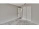 The bedroom has light gray walls, a double door closet, and a standard door leading to another room at 814 Seabreeze Dr, Ruskin, FL 33570
