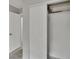 Bedroom closet with sliding doors and a standard door leading to another room at 814 Seabreeze Dr, Ruskin, FL 33570