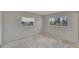 Bedroom with two windows that provide natural light at 814 Seabreeze Dr, Ruskin, FL 33570