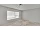 The bedroom has light gray walls and a window to let in natural light at 814 Seabreeze Dr, Ruskin, FL 33570