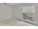 Bedroom featuring a window overlooking the lawn at 814 Seabreeze Dr, Ruskin, FL 33570