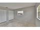Bright bedroom featuring a window and large closet with bi-fold doors at 814 Seabreeze Dr, Ruskin, FL 33570