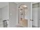 Hallway with an arched entrance into kitchen; view to a bedroom, front door, and closet at 814 Seabreeze Dr, Ruskin, FL 33570