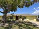 Charming home with beautiful landscaping and mature trees at 814 Seabreeze Dr, Ruskin, FL 33570