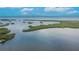 Scenic water view featuring small islands and calm waters on a bright, sunny day at 814 Seabreeze Dr, Ruskin, FL 33570