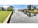Scenic waterfront view featuring a private canal and backyard docks on a sunny day at 814 Seabreeze Dr, Ruskin, FL 33570