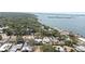 Stunning aerial view of the coastal homes surrounded by lush greenery and bay access at 8347 41St N Ave, St Petersburg, FL 33709