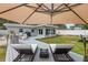 Relaxing backyard features a spacious deck with modern lounge chairs and privacy fence at 8347 41St N Ave, St Petersburg, FL 33709