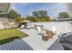 Inviting backyard with lounge chairs, outdoor bar, and fire pit, perfect for entertaining at 8347 41St N Ave, St Petersburg, FL 33709