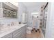 Bathroom with marble countertops, stylish fixtures, and a glass-enclosed shower, complete with neutral colored accent tiles at 8347 41St N Ave, St Petersburg, FL 33709