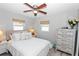 Cozy bedroom showcases natural light with a comfortable bed, light colored walls, and decorative furniture at 8347 41St N Ave, St Petersburg, FL 33709