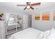 Well-lit bedroom featuring a comfortable bed, reflected mirrored closet, and views of colorful art pieces at 8347 41St N Ave, St Petersburg, FL 33709