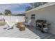 Outdoor deck with grill, Adirondack chairs, and table, perfect for relaxing at 8347 41St N Ave, St Petersburg, FL 33709
