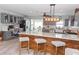 Spacious kitchen with gray cabinets, modern appliances, and island seating at 8347 41St N Ave, St Petersburg, FL 33709