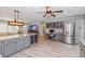 Modern kitchen featuring a wine cooler, stainless steel appliances, and an adjacent living area at 8347 41St N Ave, St Petersburg, FL 33709